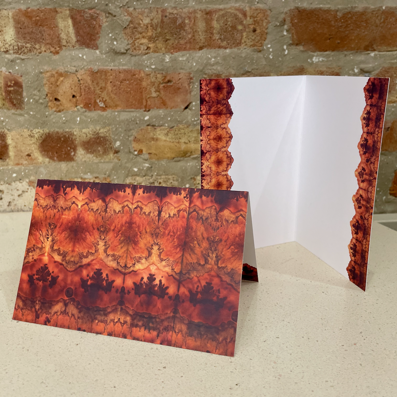 red abstract greeting card with a red border inside the card but no text